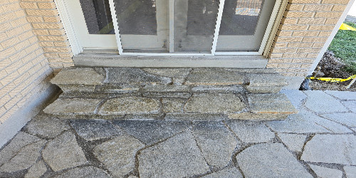 Patio with a stone wall